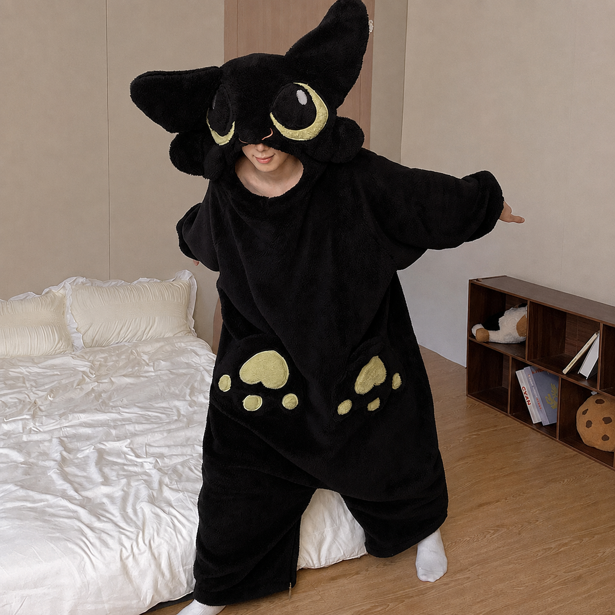 Black plush dragon onesie, worn